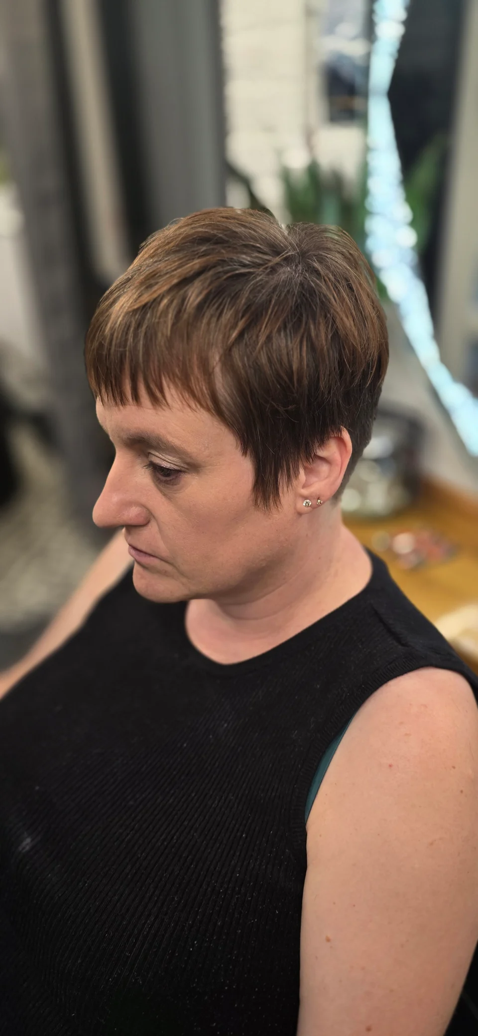 Short brunette pixie cut with textured layers
